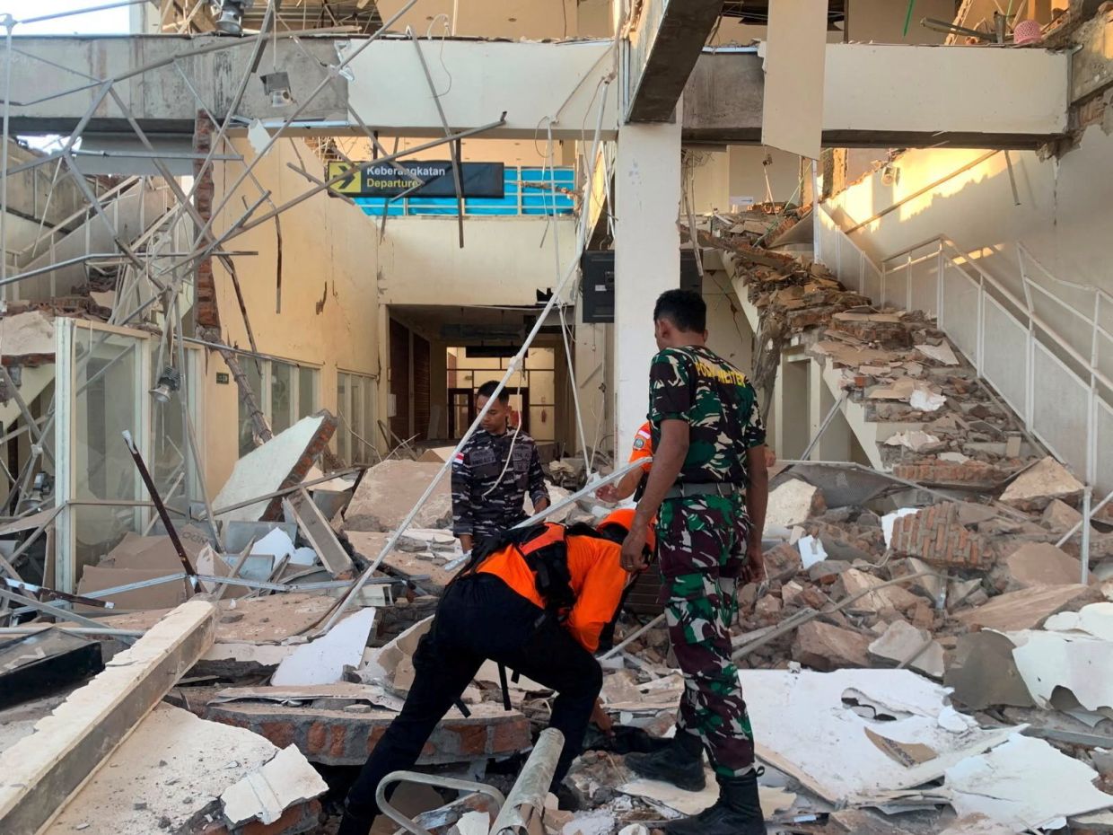 Rescuers inspect a heavily-damaged building at L. Say port following an earthquake, in Sikka, East Nusa Tenggara province, Indonesia, August 15, 2026. Indonesian Search and Rescue Agency (Basarnas)/Handout via REUTERS ATTENTION EDITORS - THIS IMAGE HAS BEEN SUPPLIED BY A THIRD PARTY. MANDATORY CREDIT. NO RESALES. NO ARCHIVES.       TPX IMAGES OF THE DAY     